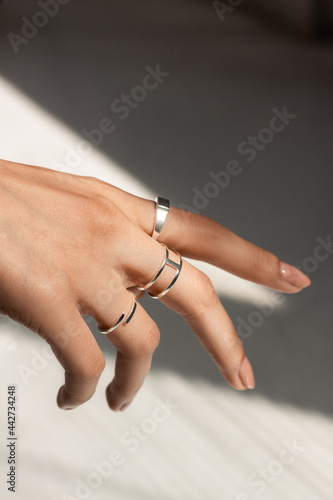 Woman hand posing showing her rings and jewellry