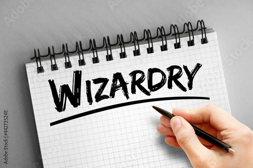Wizardry text on notepad, concept background photo