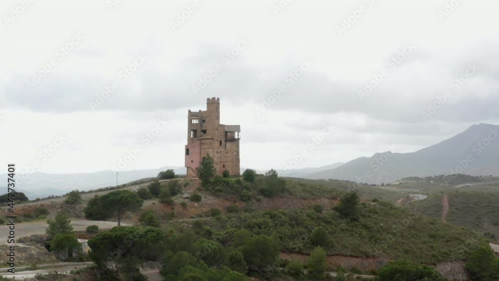 Drone View of a Castle on Top Of a Hill in the Green Fields Drone View of a Castle on Top Of a Hill in the Green Fields