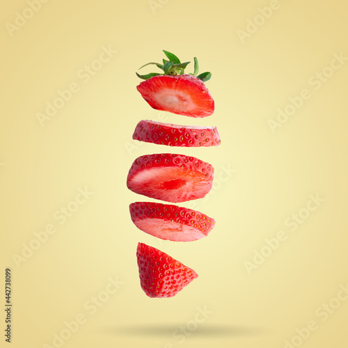 Strawberry berries levitating on a white background. Isolated object on a white background.