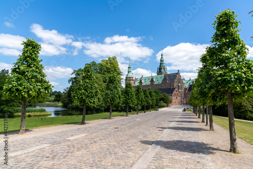 long tree-lined alley leading to the Frederiksborg Castle in Hillerod © makasana photo