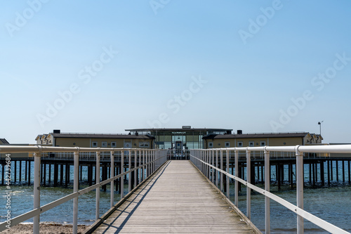boardwalk leading to the historic bath houe of Palsjo near Malmo on the Baltic Sea in Sweden on a beautiful summer day