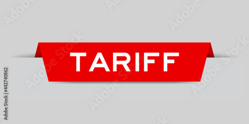 Red color inserted label with word tariff on gray background
