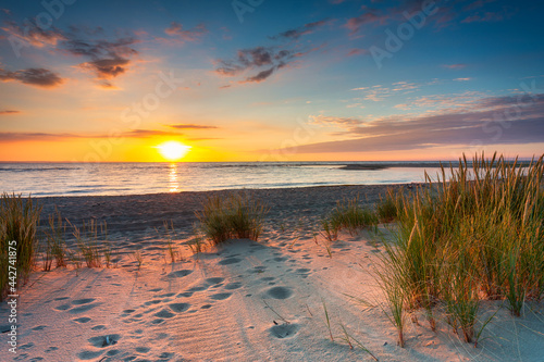 A beautiful sunset on the beach of the Sobieszewo Island at the Baltic Sea. Poland