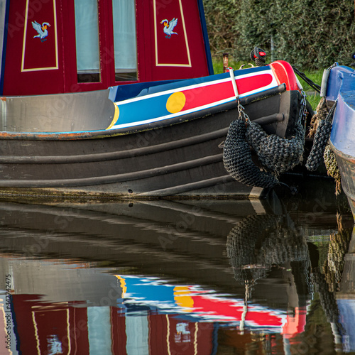 Fototapeta The rear of a colourful barge on the Leeds to Liverpool canal in Yorkshire, Engl