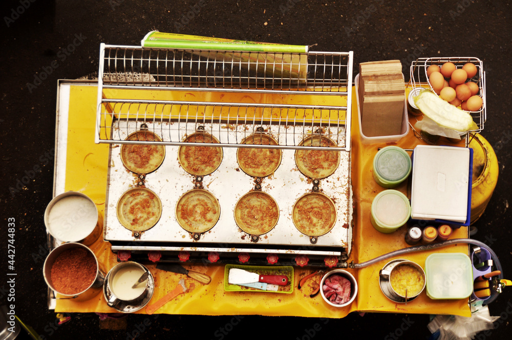 Filipino chef vendor cooking local street food philippine style at