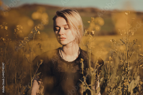 young dreamy woman in countryside photo