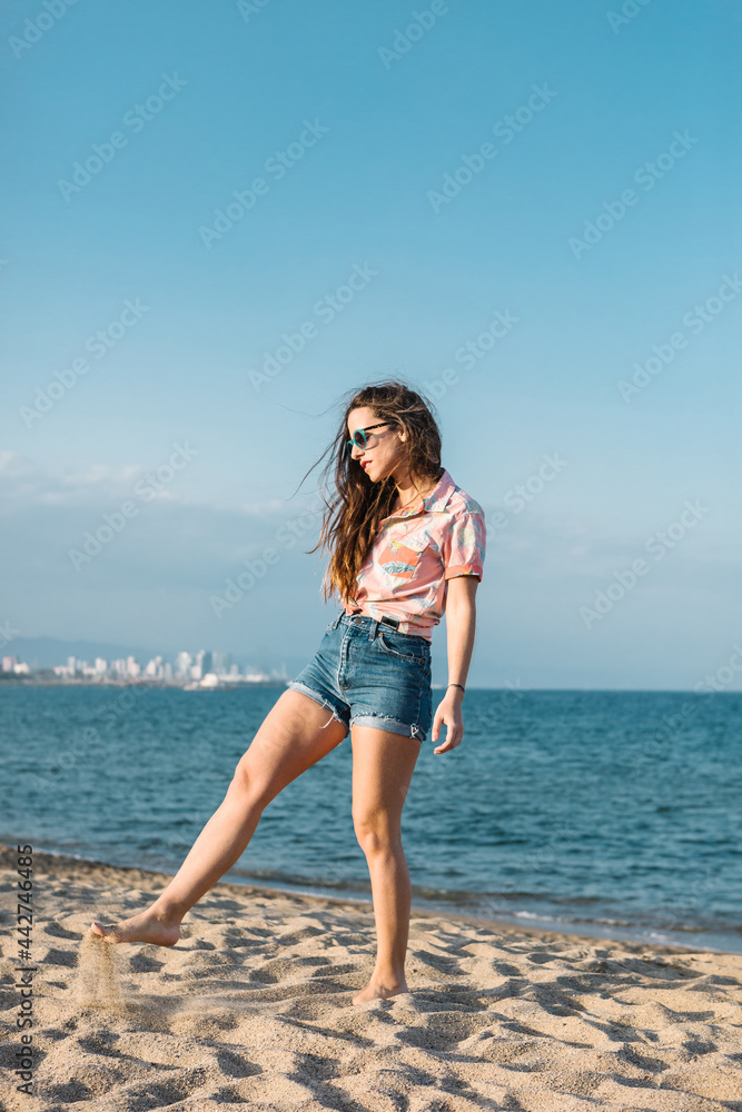 Carefree hipster woman on sandy beach Carefree hipster woman on sandy beach