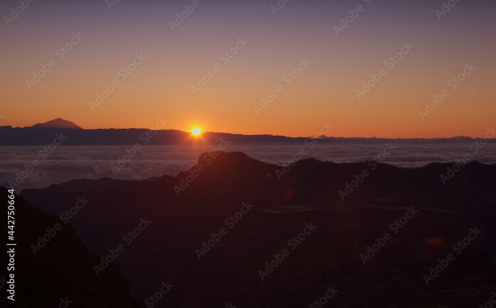 Gran Canaria, landscape of the central part of the island, Las Cumbres, ie The Summits, short hike between rock Formation 
Chimirique and iconic Roque Nublo, evening light
