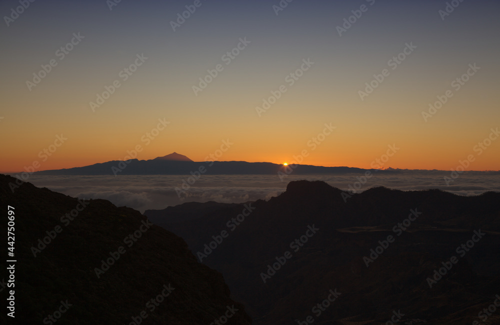 Gran Canaria, landscape of the central part of the island, Las Cumbres, ie The Summits, short hike between rock Formation 
Chimirique and iconic Roque Nublo, evening light

