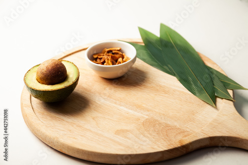 Wallpaper Mural Avocado and nuts on a wooden board. Healthy food rich in protein. Ingredients full of healthy fat on the table. High quality photo Torontodigital.ca