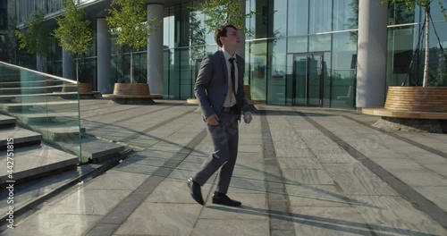 businessman going down the stairs takes off his mask and makes a jump from happiness, he learned that he is not sick covid-19 and received a negative test