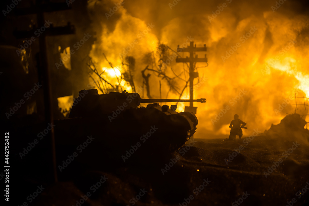 Fototapeta premium War Concept. Military silhouettes fighting scene on war fog sky background, World War Soldiers Silhouette Below Cloudy Skyline At night. Battle in ruined city. Selective focus