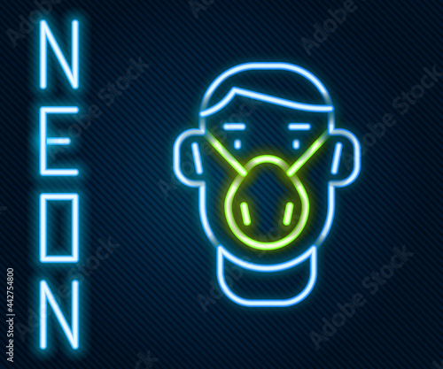 Glowing neon line Man face in a medical protective mask icon isolated on black background. Quarantine. Colorful outline concept. Vector