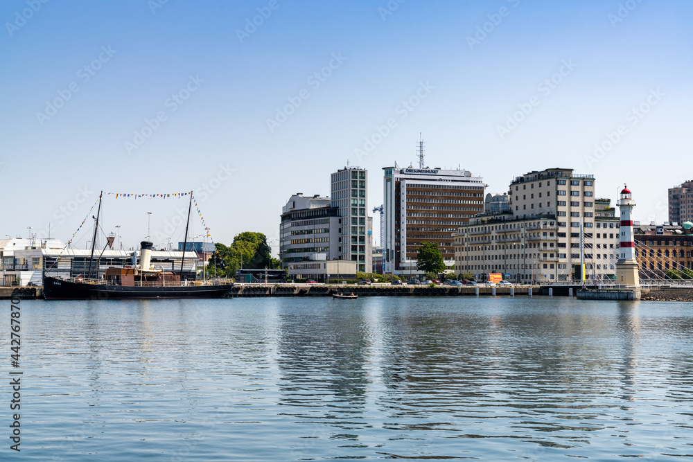 view of the harbor and lighthosue in downtown Malmo