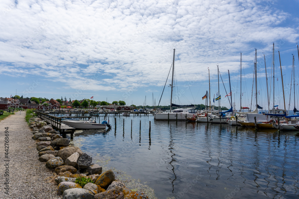 view of the harbor front promenade and marina and yacht harbor in Nysted