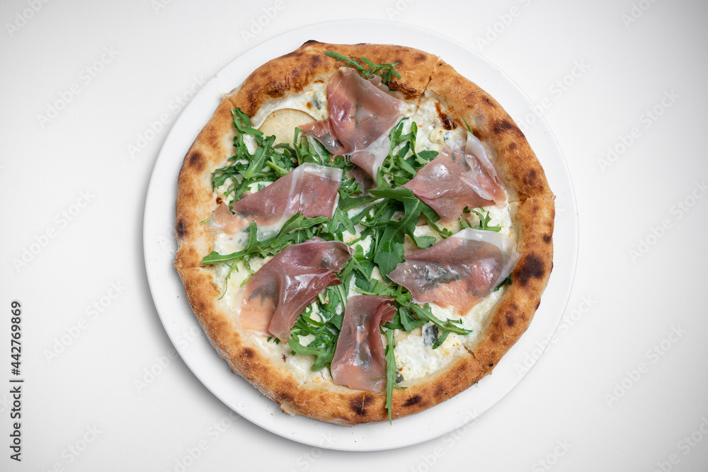 top view of tasty pizza with prosciutto, arugula and cheese on white background top view of tasty pizza with prosciutto, arugula and cheese on white background