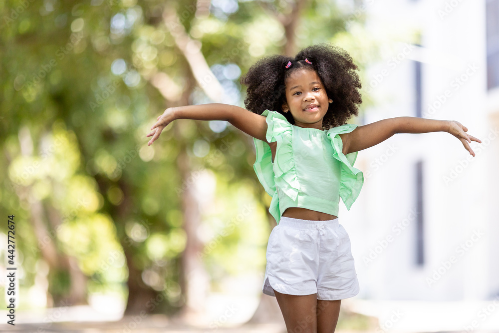Afro American children happy under the tree