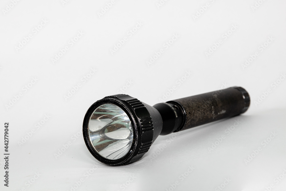 black flashlight isolated on white black flashlight isolated on white