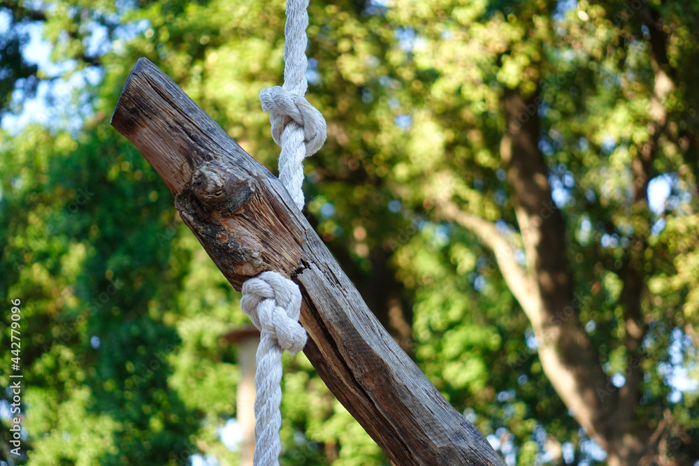 Log tied to rope at obstacle course 