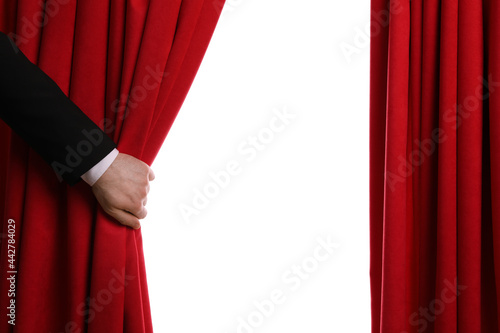 Man opening red front curtains on white background, closeup