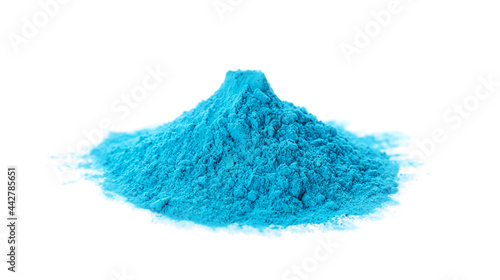 Light blue powder dye on white background. Holi festival