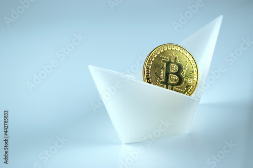 Wallpaper Mural A bitcoin coin in a white boat on a whit background. Crypto Industry. Torontodigital.ca