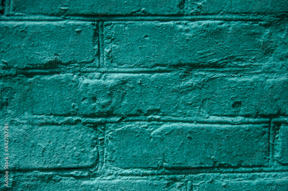 Fototapeta premium Brick green background. Wall of old green brick. Background