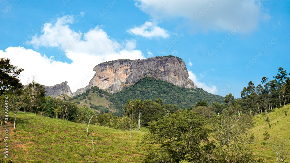 Countryside scene in São Bento do Sapucaí, São Paulo, Brazil. On background, rock formation known as Pedra do Baú