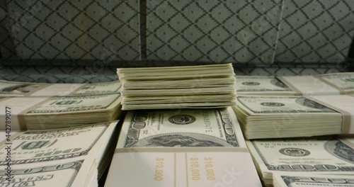Close up shot of briefcase full of 100 US dollars packs. A suitcase stuffed with cash. Currency, cash flow, business and financing 4k footage