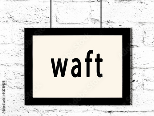 Photography Black frame hanging on white brick wall with inscription waft