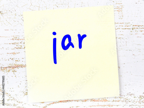 Yellow sheet of paper with word jar. Reminder concept