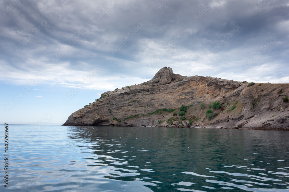 Dolphin rock in the Crimea. A mountain jutting out into the sea.