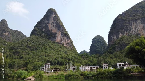 Wallpaper Mural View of Yangshuo mountains in China very popular chinese tourist destination for both foreign as domestic tourists area is known for the karst pointy peaks mountains 4k high resolution quality Torontodigital.ca