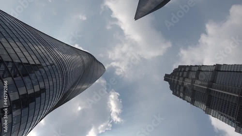 Down top time lapse view of downtown Shanghai three skyscrapers the Jin Mao Tower the World Financial Center and the Shanghai-tower the tallest towers in largest city on the earth high resolution photo