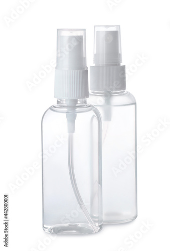 Spray bottles with antiseptic on white background