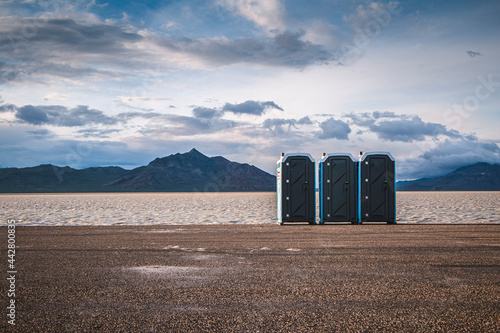 Three Portable toilets stand next to the Bonneville Salt Flats, Utah photo