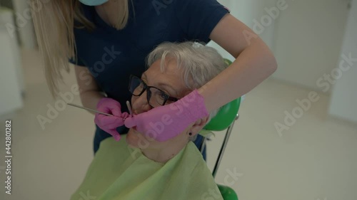 Female doctor working with senior patient.