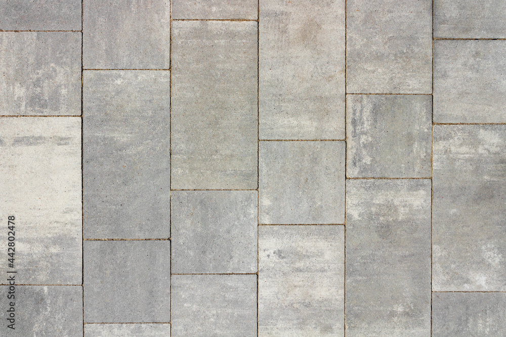 Fototapeta premium Texture photo of grey colored concrete pavement road tile texture.