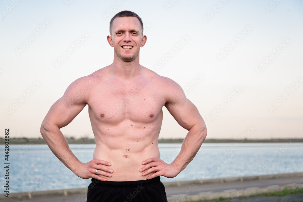 Obraz premium handsome muscle man near of river