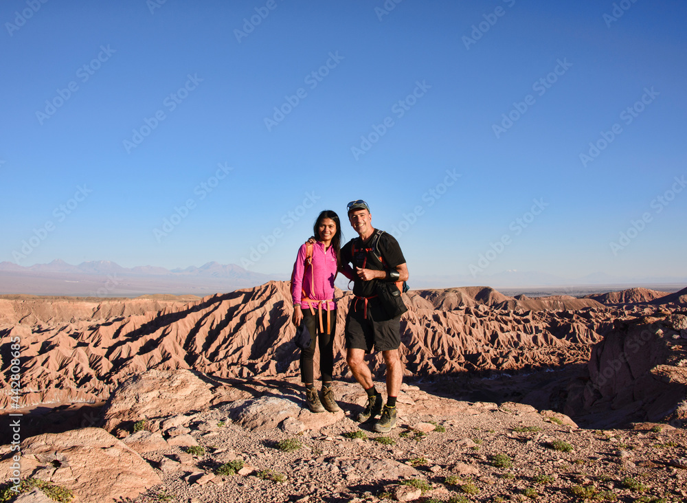 Trekkers above the amazing desert landscape in the Valle Marte, San Pedro de Atacama, Chile