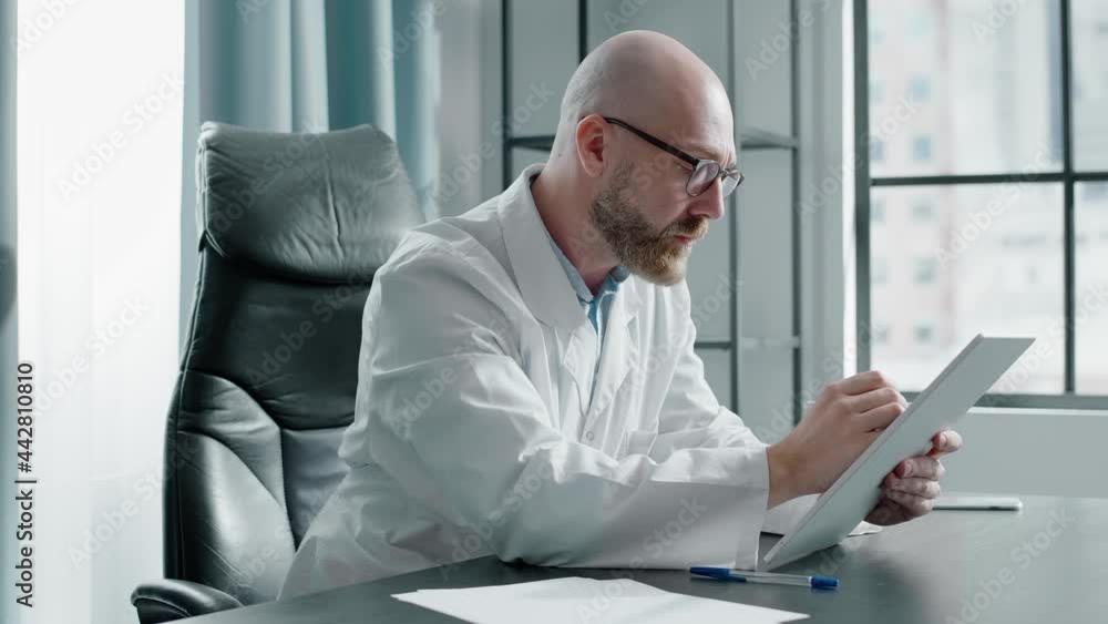 Medical consultant analyzes patient examination results Medical consultant analyzes patient examination results