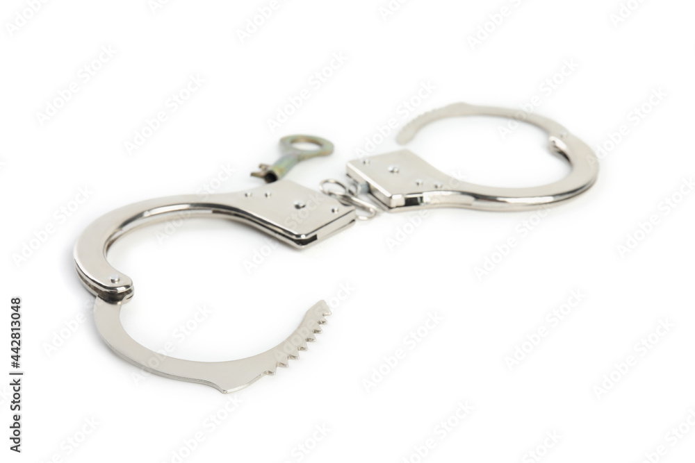 Classic chain handcuffs with key on white background Classic chain handcuffs with key on white background