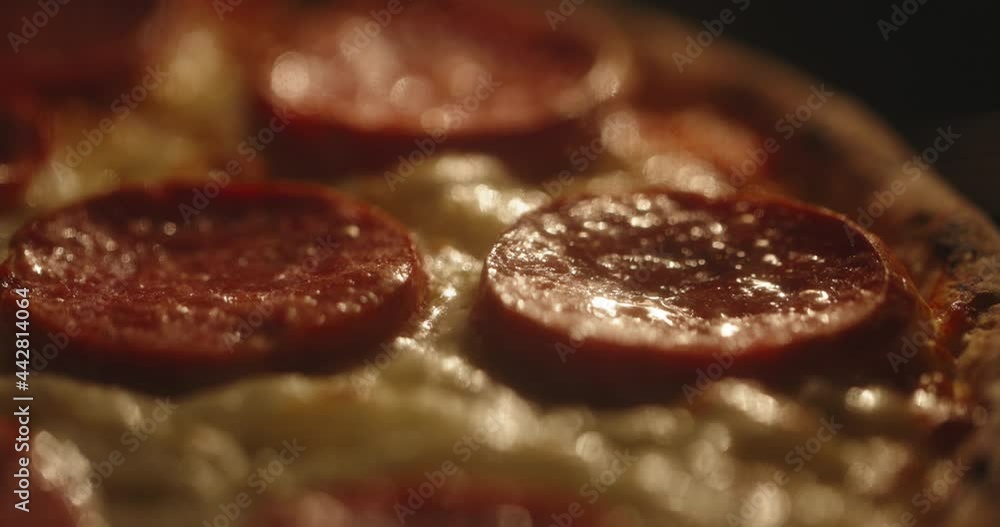 Close up shot of delicious pepperoni pizza with mozzarella being cooked in the oven. Tasty Italian pizza - food and drink 4k footage Close up shot of delicious pepperoni pizza with mozzarella being cooked in the oven. Tasty Italian pizza - food and drink 4k footage