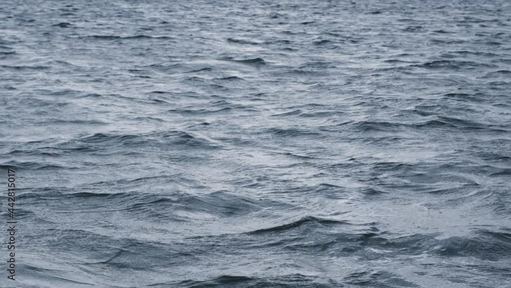 View over calm sea or ocean with beautiful evening sun reflection. Landscapes view of endless aquamarine sea water in summer day View over calm sea or ocean with beautiful evening sun reflection. Landscapes view of endless aquamarine sea water in summer day