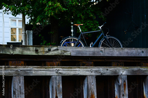 Bicycle on the waterfront in Copenhagen, Denmark. Old town architecture and eco friendly transport. Copenhagen style, European street, Denmark bicycle