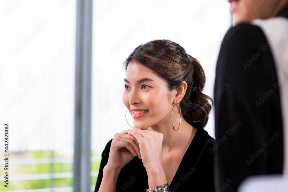 Asia cheerful businesswoman working at the table in office