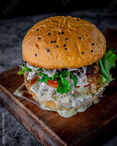 Big blue cheese burger with black background