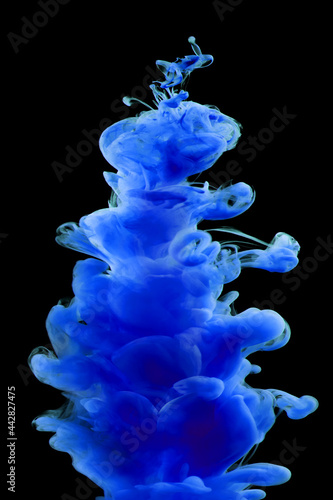 Blue paint in water isolated on black background