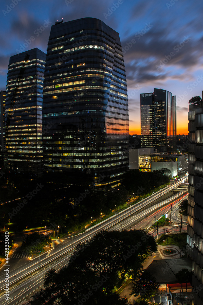 aerial view of commercial offices buildings on Juscelino Kubitschek Avenue, with the sunset in the background in the south side of Sao Paulo, city aerial view of commercial offices buildings on Juscelino Kubitschek Avenue, with the sunset in the background in the south side of Sao Paulo, city